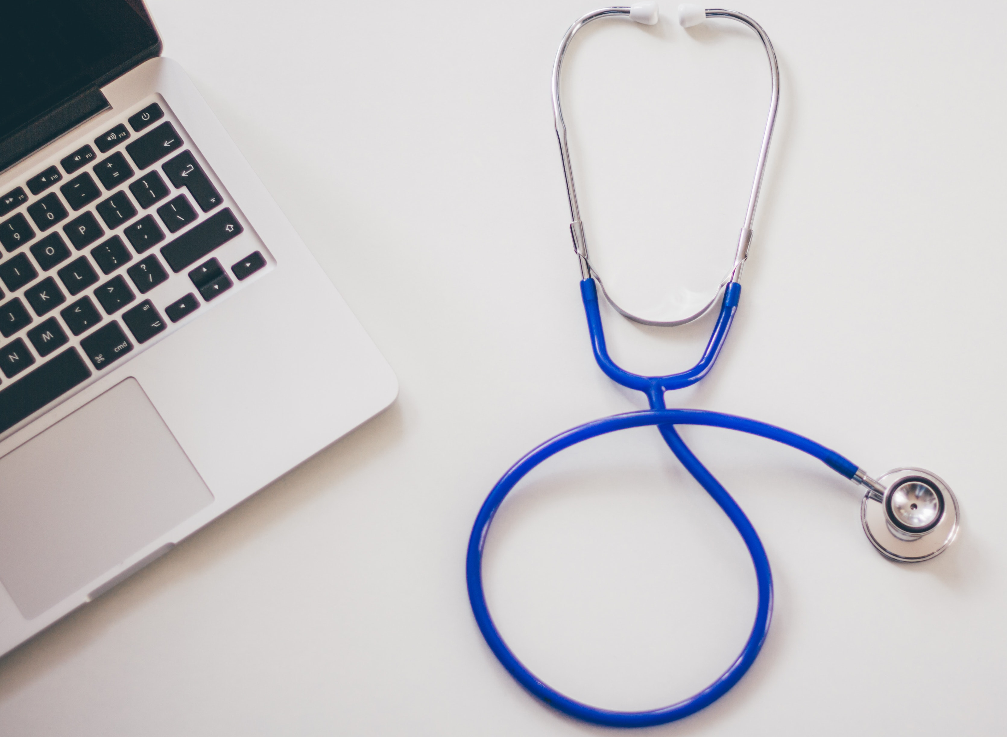 Stethoscope on desk near computer